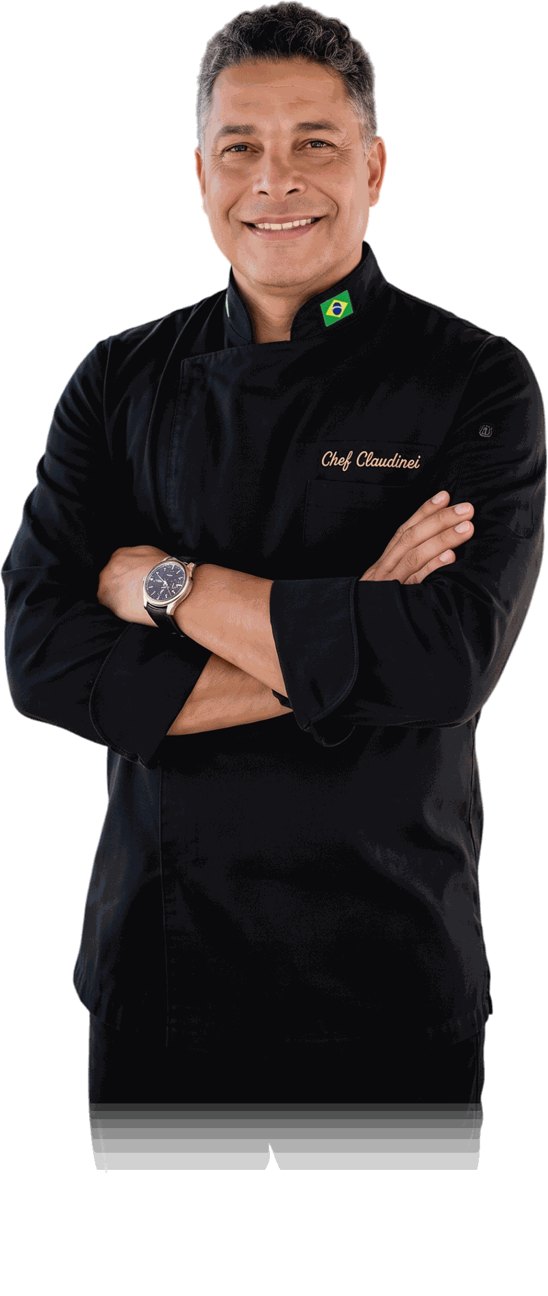 Chef Claudinei standing with his arms crossed in his black chef's coat